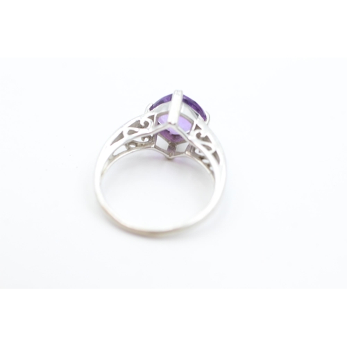 1030 - A 9ct white gold amethyst and diamond dress ring, size N½ - approx. gross weight 3.7 grams