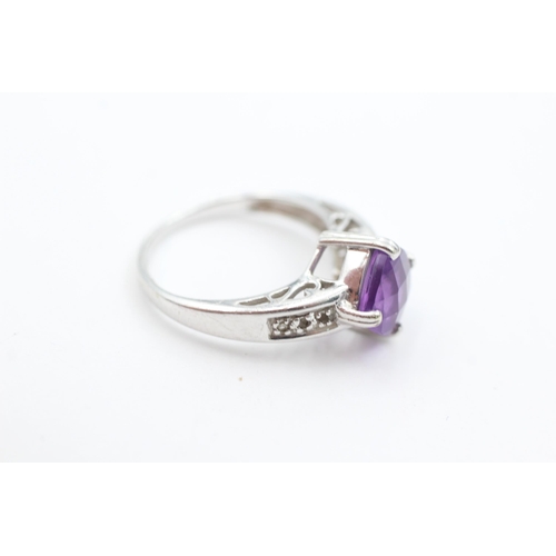 1030 - A 9ct white gold amethyst and diamond dress ring, size N½ - approx. gross weight 3.7 grams