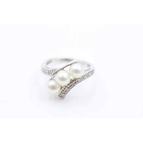 1034 - A 9ct white gold pearl and diamond dress ring, size K½ - approx. gross weight 2.9 grams