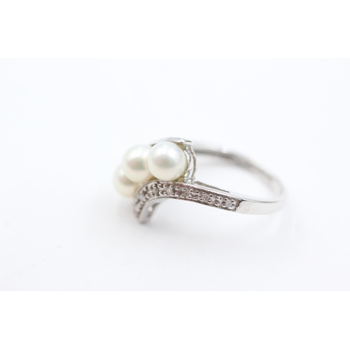 1034 - A 9ct white gold pearl and diamond dress ring, size K½ - approx. gross weight 2.9 grams