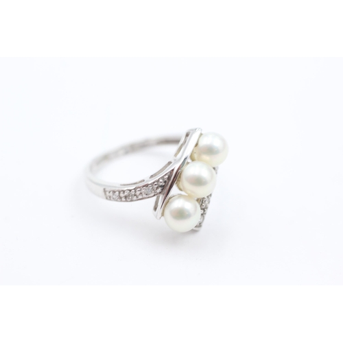 1034 - A 9ct white gold pearl and diamond dress ring, size K½ - approx. gross weight 2.9 grams