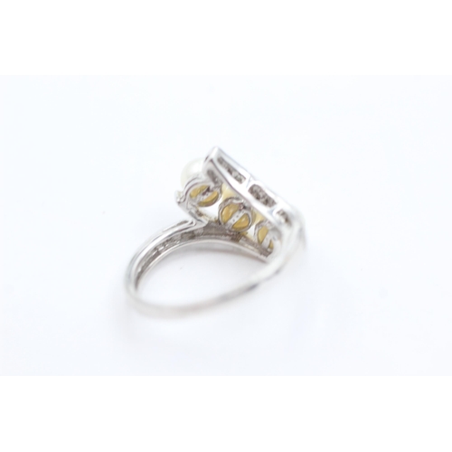 1034 - A 9ct white gold pearl and diamond dress ring, size K½ - approx. gross weight 2.9 grams