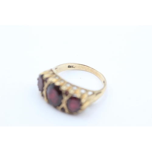 1035 - A 9ct gold garnet gypsy ring, size P½ - approx. gross weight 4.3 grams