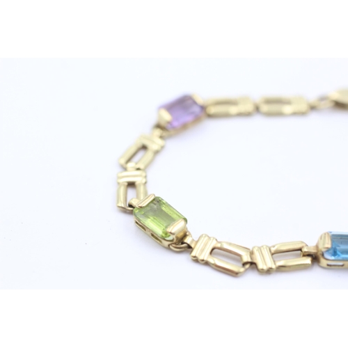 1038 - A 9ct gold garnet, peridot, topaz, citrine and amethyst bracelet - approx. gross weight 4.6 grams