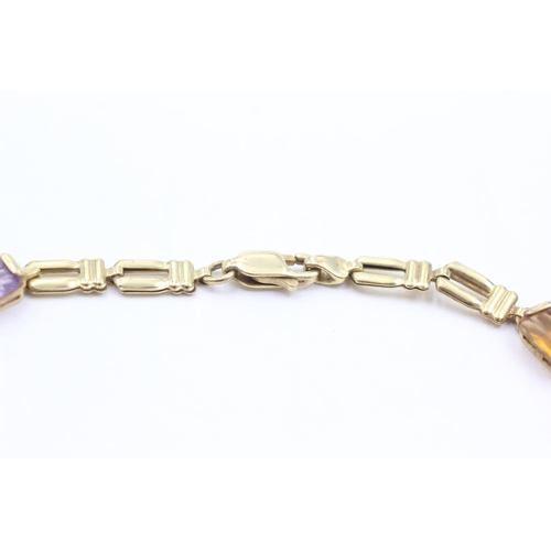 1038 - A 9ct gold garnet, peridot, topaz, citrine and amethyst bracelet - approx. gross weight 4.6 grams