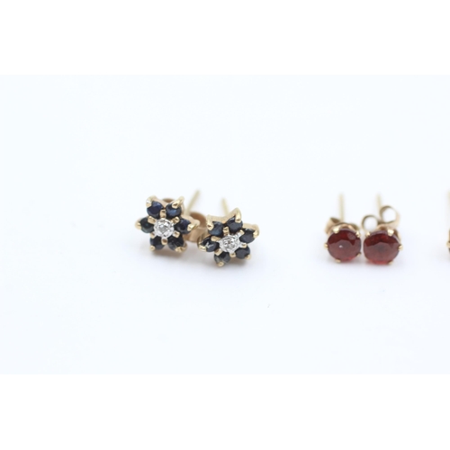 1043 - Three pairs of 9ct gold gemstone earrings, garnet, amethyst and sapphire - approx. gross weight 1.5 ... 