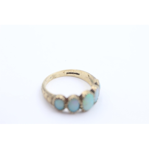 1045 - A 9ct gold opal five stone ring, size N - approx. gross weight 3.1 grams