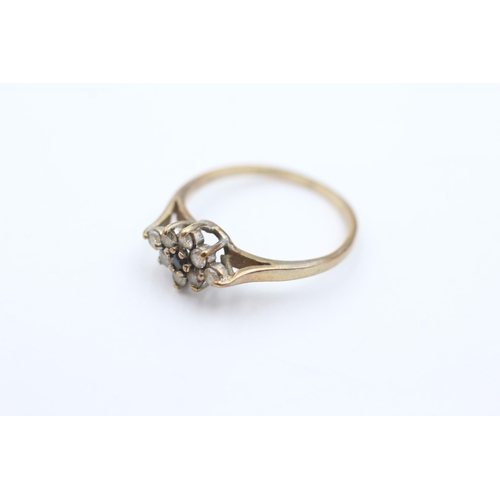 1051 - A 9ct gold sapphire and CZ ring, size J½ - approx. gross weight 1.4 grams