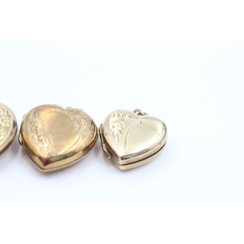 1055 - Three 9ct gold back and front floral etched heart lockets - approx. gross weight 9.5 grams