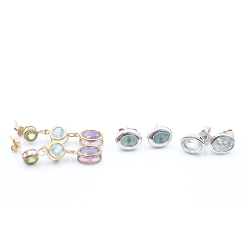 1057 - Three pairs of 9ct gold gemstone earrings, two topaz and one amethyst, peridot and aquamarine - appr... 