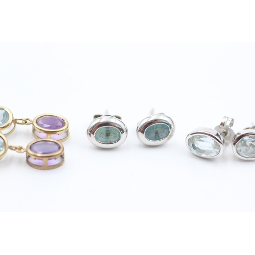 1057 - Three pairs of 9ct gold gemstone earrings, two topaz and one amethyst, peridot and aquamarine - appr... 