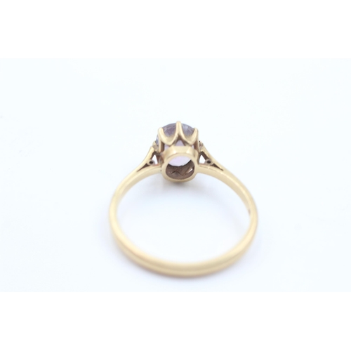 1058 - A 9ct gold amethyst solitaire ring, size T½ - approx. gross weight 3.4 grams