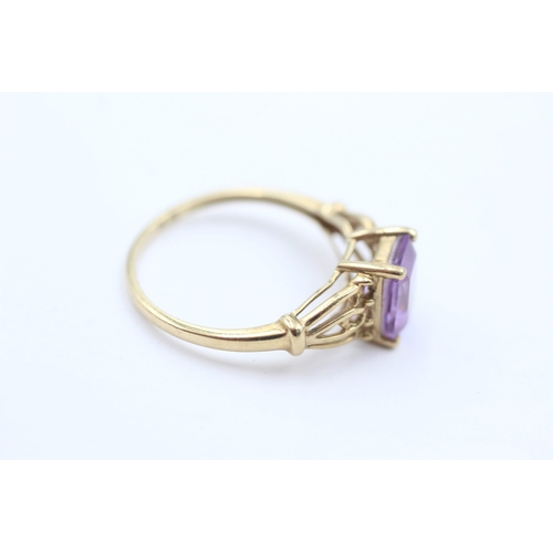 1060 - A 9ct gold amethyst solitaire ring, size O½ - approx. gross weight 1.8 grams