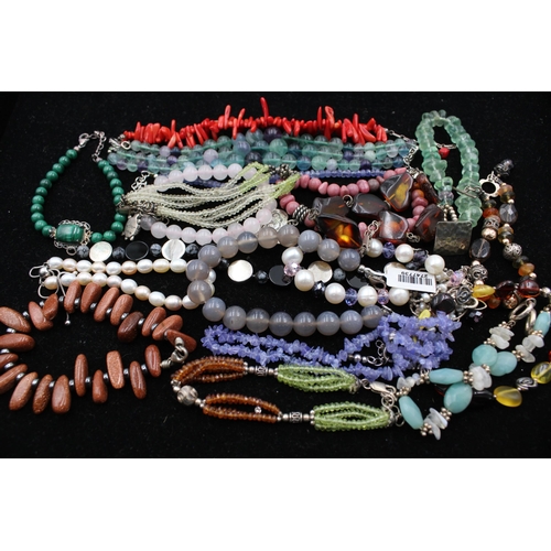 1063 - Fifteen .925 silver gemstone bracelets to include amber, peridot, agate etc. - approx. gross weight ... 