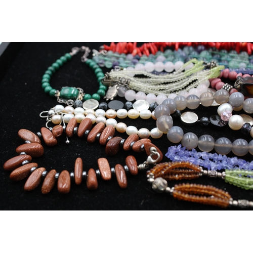 1063 - Fifteen .925 silver gemstone bracelets to include amber, peridot, agate etc. - approx. gross weight ... 