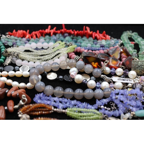 1063 - Fifteen .925 silver gemstone bracelets to include amber, peridot, agate etc. - approx. gross weight ... 