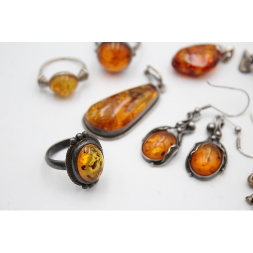 1093 - Eight pieces of .925 silver amber jewellery to include pendants, earrings etc. - approx. gross weigh... 