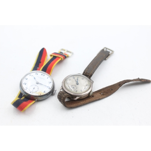 1174 - Two 1930s .925 silver cased mechanical trench style wristwatches to include J. W. Benson etc.