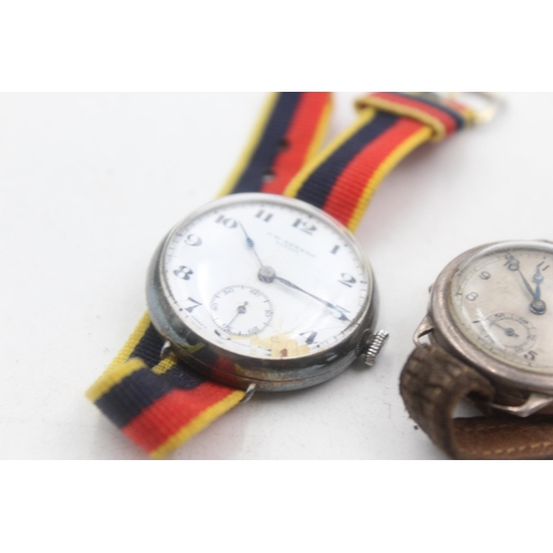 1174 - Two 1930s .925 silver cased mechanical trench style wristwatches to include J. W. Benson etc.