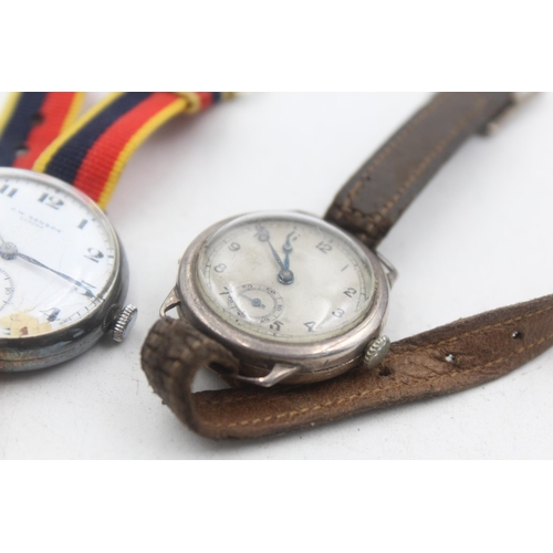 1174 - Two 1930s .925 silver cased mechanical trench style wristwatches to include J. W. Benson etc.