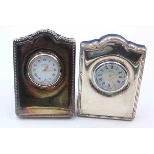 1209 - Two R. Carr hallmarked sterling silver fronted quartz boudoir clocks