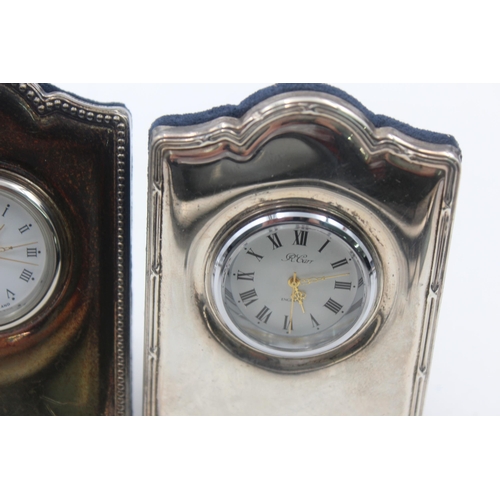 1209 - Two R. Carr hallmarked sterling silver fronted quartz boudoir clocks