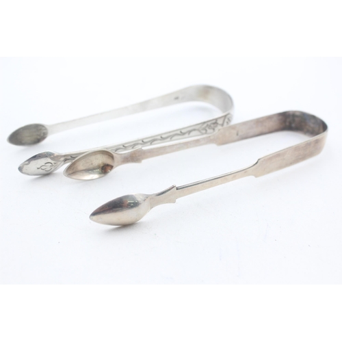 1224 - Two pairs of Georgian hallmarked sterling silver sugar tongs - approx. gross weight 65 grams