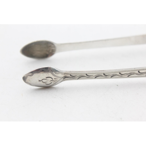 1224 - Two pairs of Georgian hallmarked sterling silver sugar tongs - approx. gross weight 65 grams