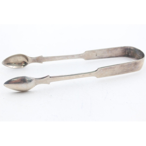 1224 - Two pairs of Georgian hallmarked sterling silver sugar tongs - approx. gross weight 65 grams