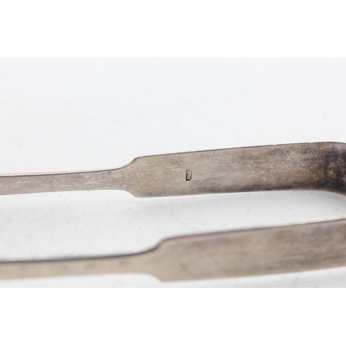 1224 - Two pairs of Georgian hallmarked sterling silver sugar tongs - approx. gross weight 65 grams