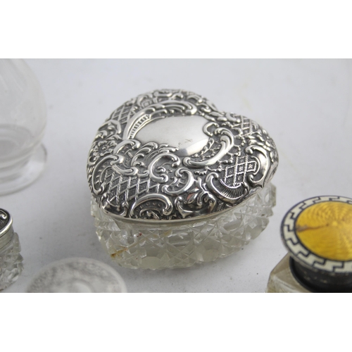 1238 - Eight hallmarked sterling silver and glass vanity jars