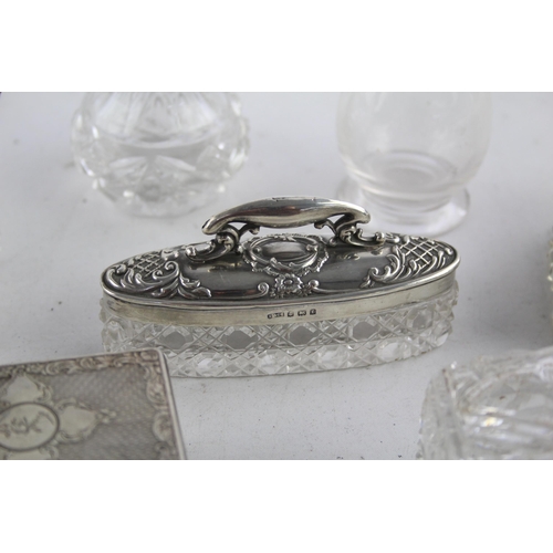 1238 - Eight hallmarked sterling silver and glass vanity jars