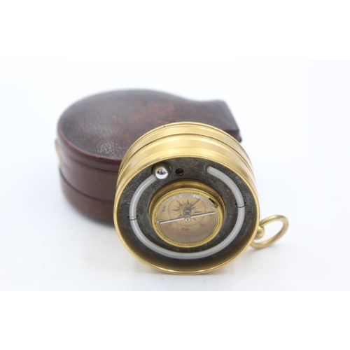 1260 - An antique leather cased J. Brown brass pocket barometer, thermometer and compass - approx. 69mm x 5... 