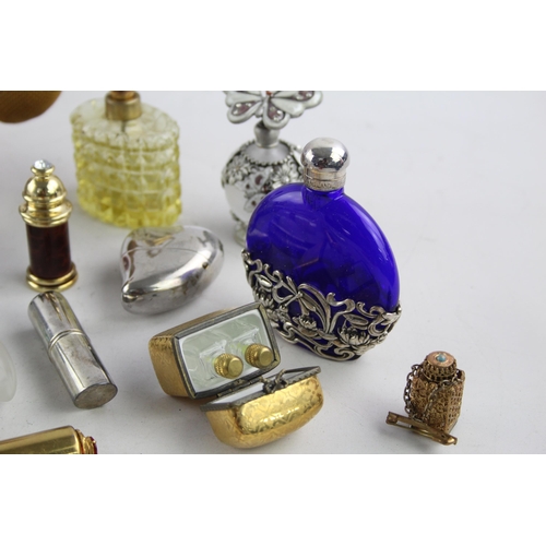 354 - A collection of vintage scent bottles and atomisers to include silver plate, mother of pearl etc.