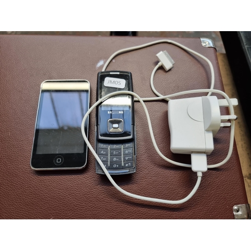 503 - Three items, one Apple iPod A1288 touch MP3 player with charger, one Samsung sliding mobile phone an... 