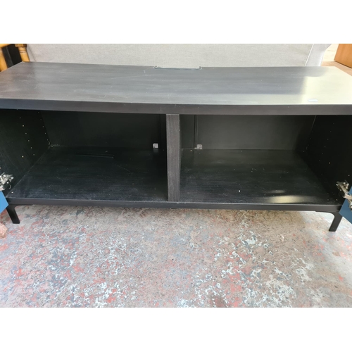 62A - A modern black ash effect and blue painted two door TV cabinet - approx. 48cm high x 120cm wide x 42... 