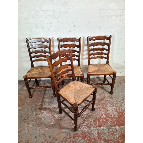 62C - Four 19th century style elm and beech rush seated Lancashire dining chairs