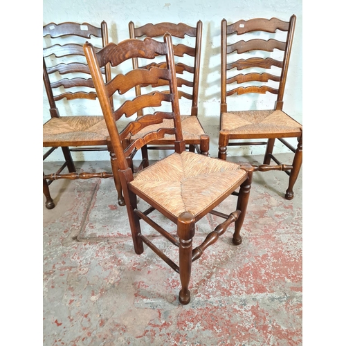 62C - Four 19th century style elm and beech rush seated Lancashire dining chairs