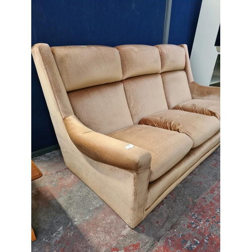 62D - A mid 20th century velvet upholstered three seater sofa