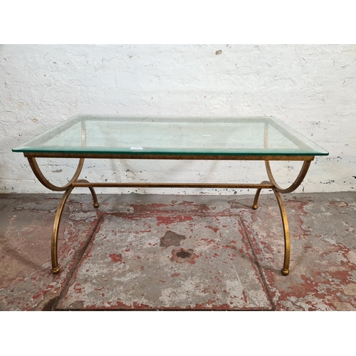 66 - A modern wrought iron and glass topped rectangular coffee table