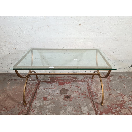 66 - A modern wrought iron and glass topped rectangular coffee table