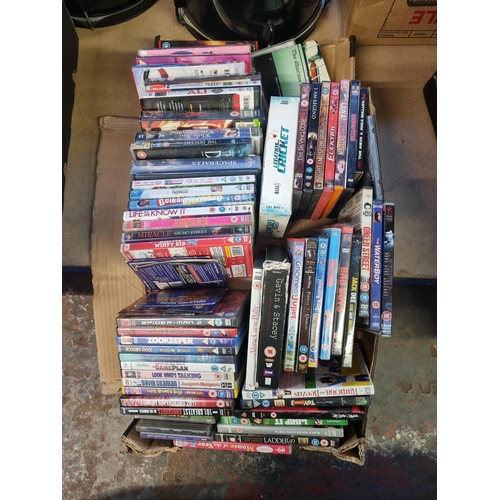 526 - Two boxes containing a collection of DVDs - see images for titles