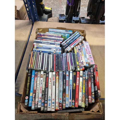 528 - Three boxes containing a collection of DVDs - see images for titles