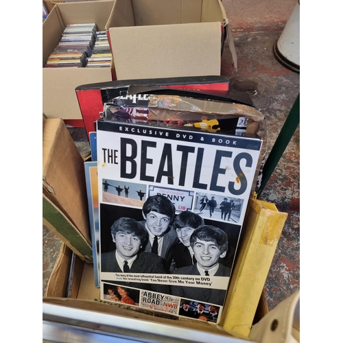 532 - A box containing The Beatles memorabilia and DVDs, guitar ornaments, recorders etc.