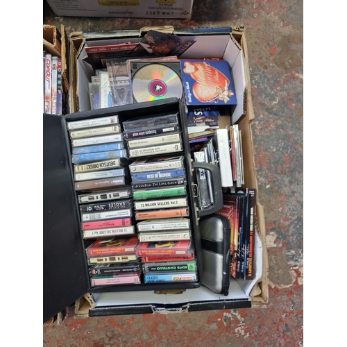 535 - Four boxes containing a collection of CDs and DVDs - see images for titles