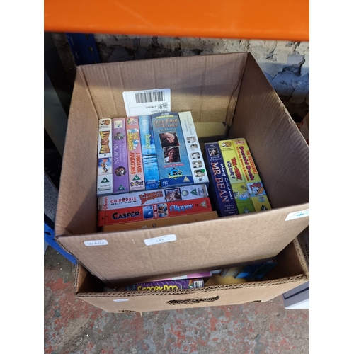 537 - Six boxes containing a large collection of VHS videos - see images for titles