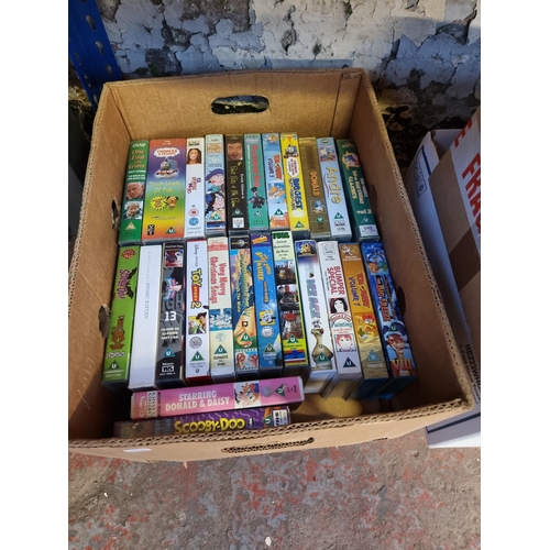 537 - Six boxes containing a large collection of VHS videos - see images for titles