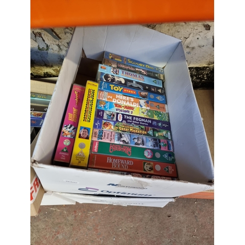 537 - Six boxes containing a large collection of VHS videos - see images for titles