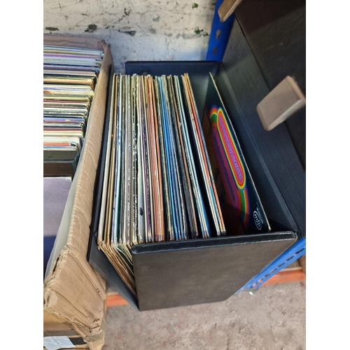 538 - Two boxes and a record case containing a collection of 7