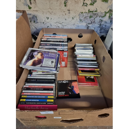 541 - A box containing a collection of DVDs and jazz and classical CDs